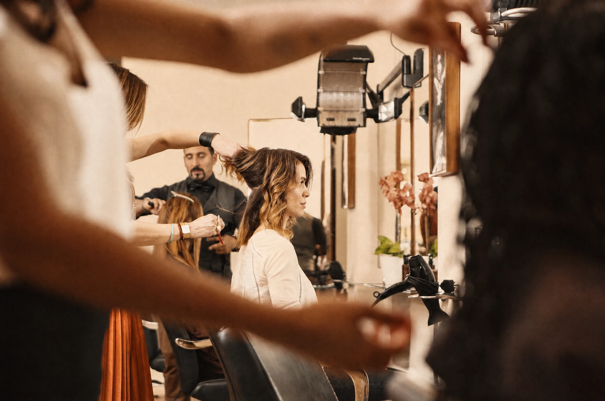 A salon owner calmly migrating client records to new software at a clean desk.